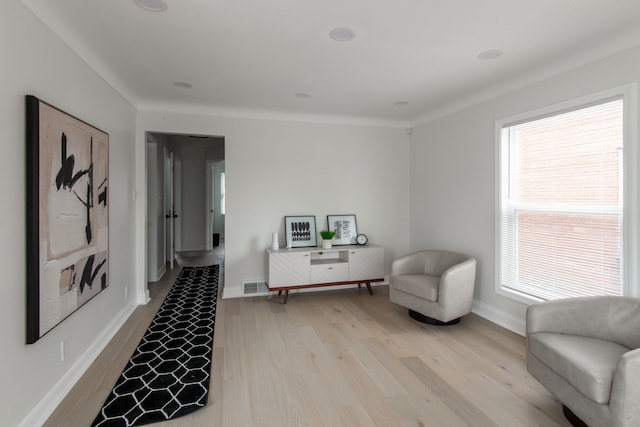 sitting room featuring light hardwood / wood-style flooring