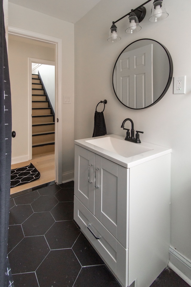 bathroom with tile patterned floors and vanity