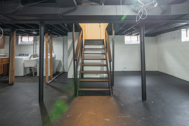 basement featuring washer / dryer and sink