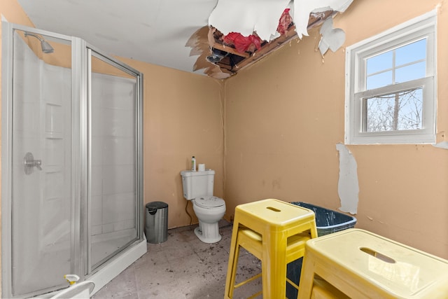 bathroom with walk in shower and toilet