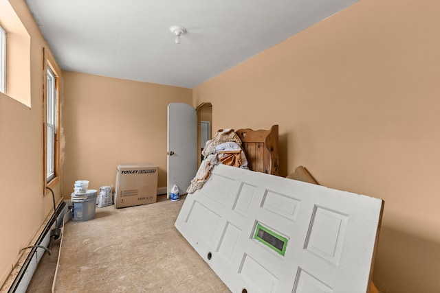 bedroom featuring a baseboard radiator