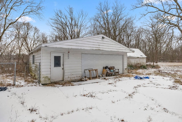 view of snow covered garage