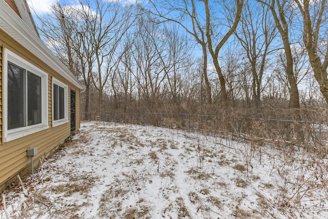 view of yard covered in snow