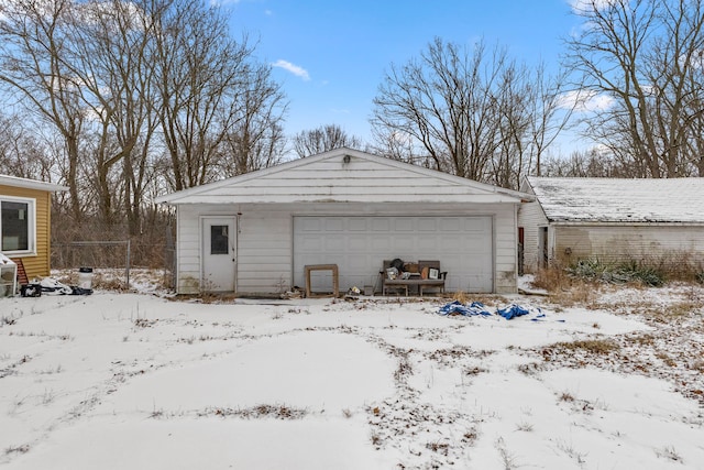 view of snow covered garage