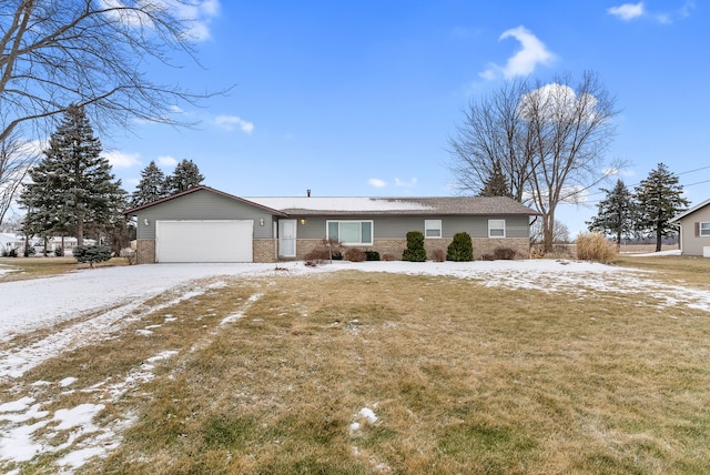 ranch-style home featuring a garage and a front lawn