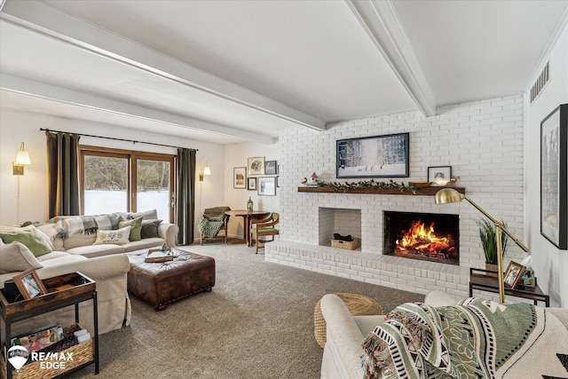 carpeted living room with brick wall, a fireplace, and beam ceiling