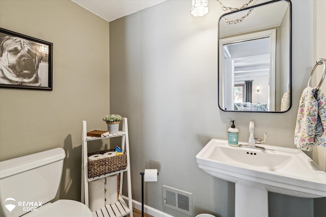 bathroom featuring sink and toilet