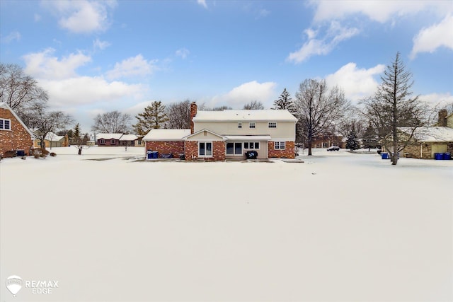 view of snow covered house