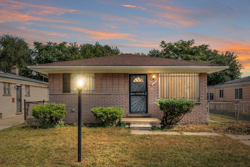 view of front of home with a lawn