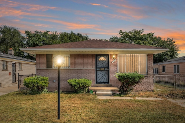 view of front of home with a lawn