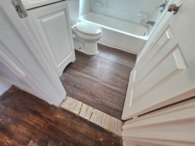 bathroom with hardwood / wood-style flooring and toilet