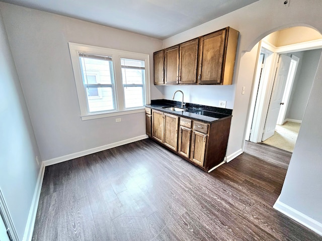 kitchen featuring sink and dark hardwood / wood-style flooring