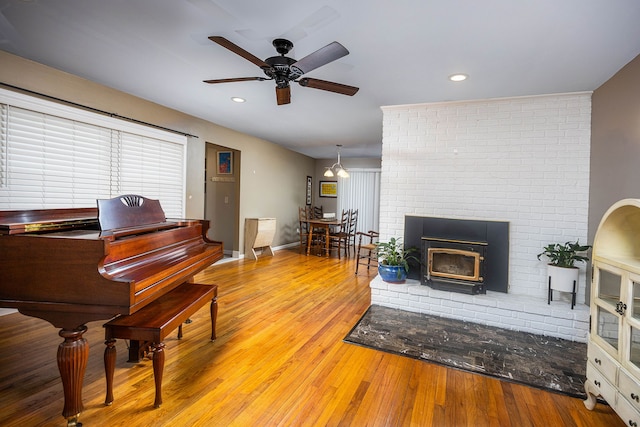 interior space with ceiling fan and light hardwood / wood-style flooring