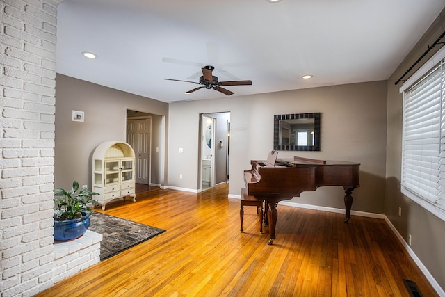 miscellaneous room featuring ceiling fan and wood-type flooring