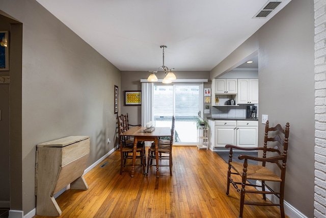 dining area featuring light wood-type flooring