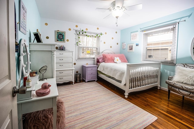 bedroom with dark wood-type flooring and ceiling fan