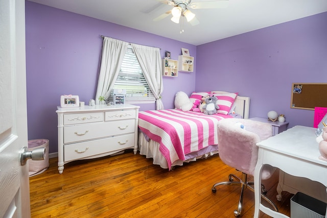 bedroom featuring ceiling fan and dark hardwood / wood-style flooring