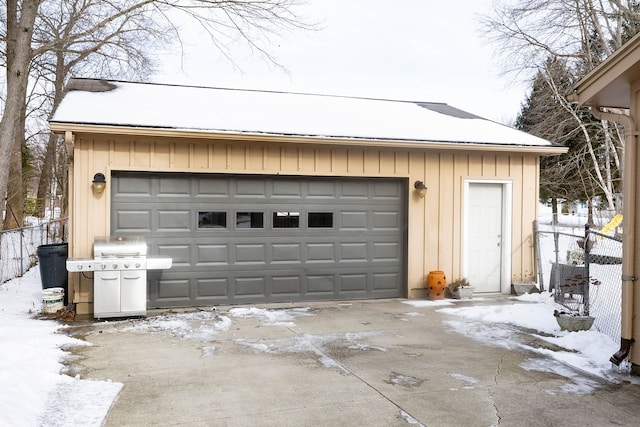 view of snow covered garage