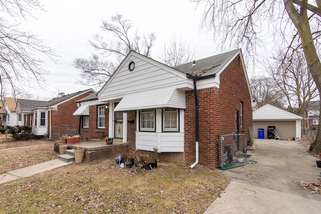 view of front of property with a garage and an outdoor structure