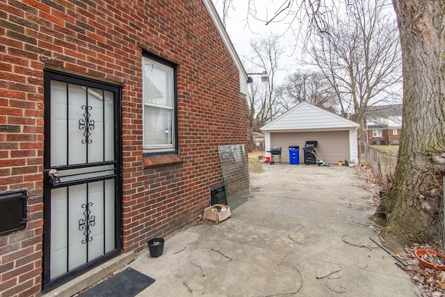 view of side of property with a garage and an outdoor structure