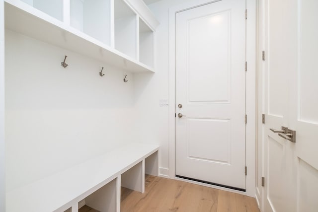 mudroom with light wood-style flooring