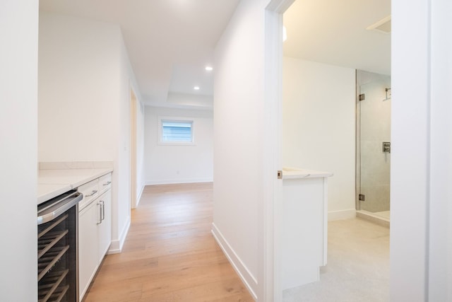 hallway featuring recessed lighting and light wood-style floors