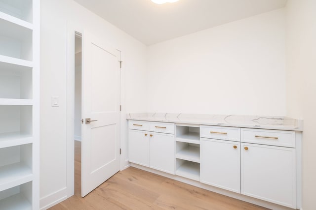 laundry area featuring light hardwood / wood-style flooring