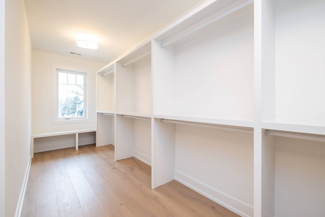 walk in closet featuring light wood-style floors and visible vents