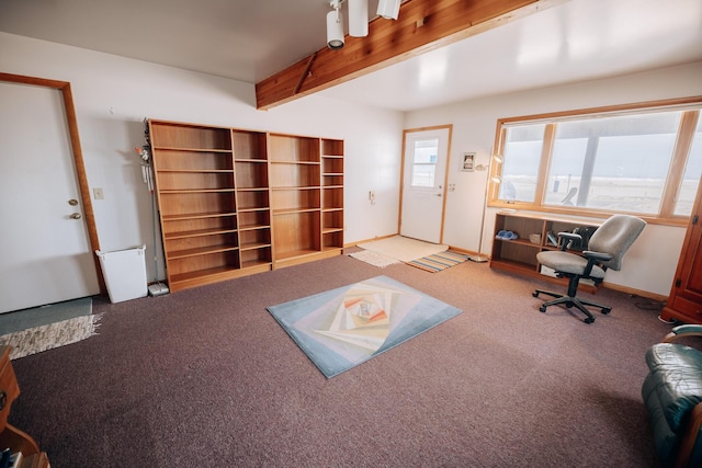 living room with beamed ceiling and carpet flooring