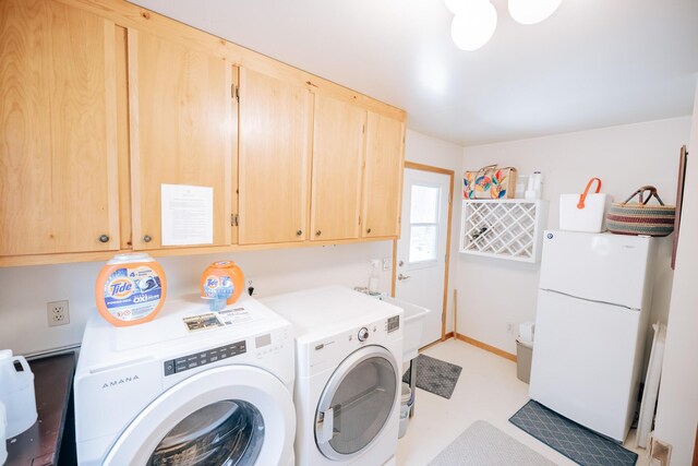 laundry room with cabinets and separate washer and dryer