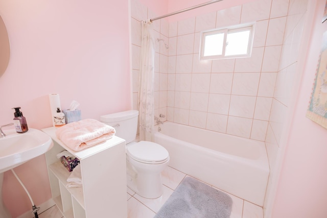 bathroom featuring tile patterned flooring, shower / bath combo with shower curtain, and toilet