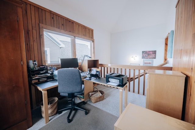 carpeted office space featuring lofted ceiling