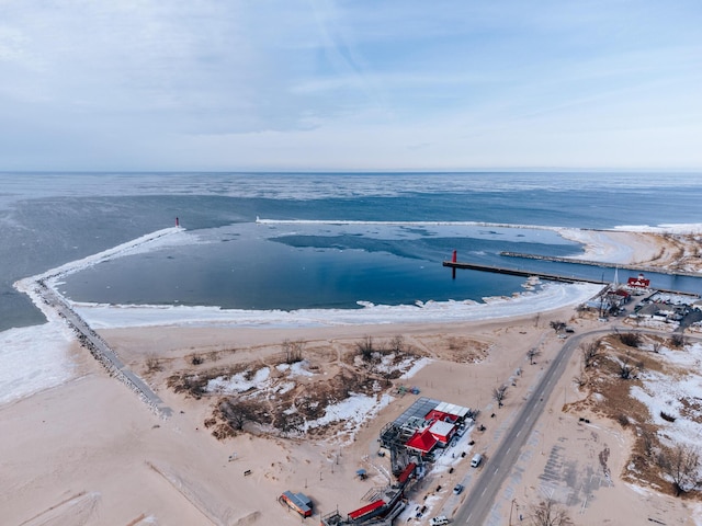 aerial view featuring a water view and a beach view