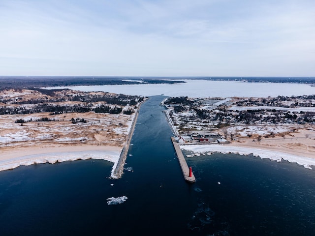 aerial view with a beach view and a water view