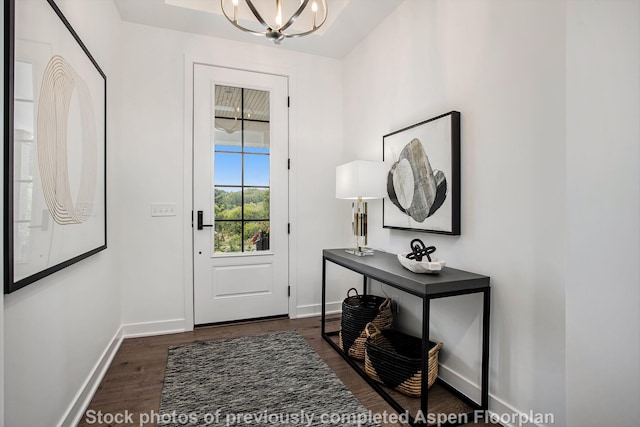 doorway to outside featuring dark hardwood / wood-style flooring and a chandelier