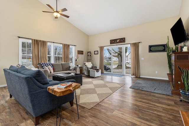 living room with ceiling fan, hardwood / wood-style floors, and high vaulted ceiling