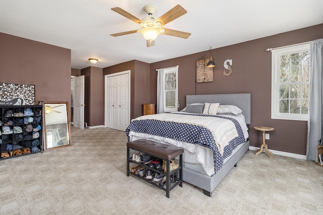 carpeted bedroom with a closet and ceiling fan