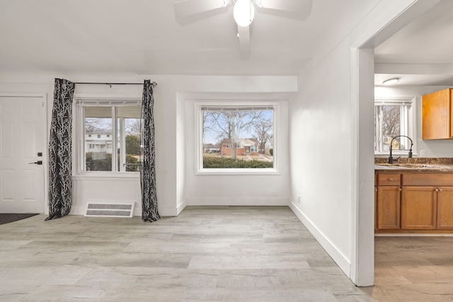 interior space featuring sink and light wood-type flooring