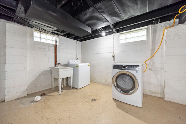 laundry area featuring separate washer and dryer and sink