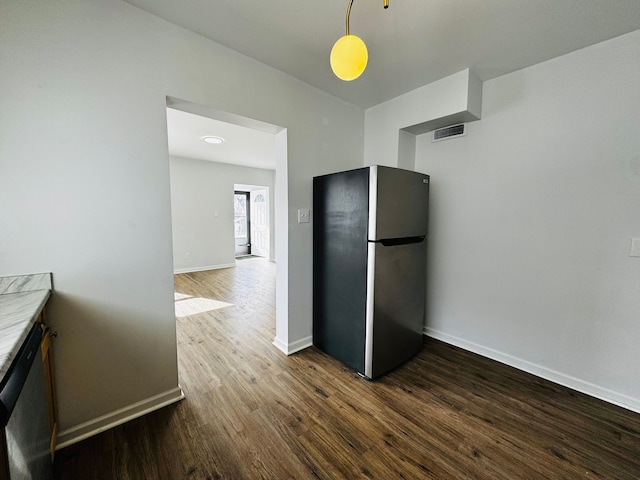 kitchen with hardwood / wood-style flooring and appliances with stainless steel finishes