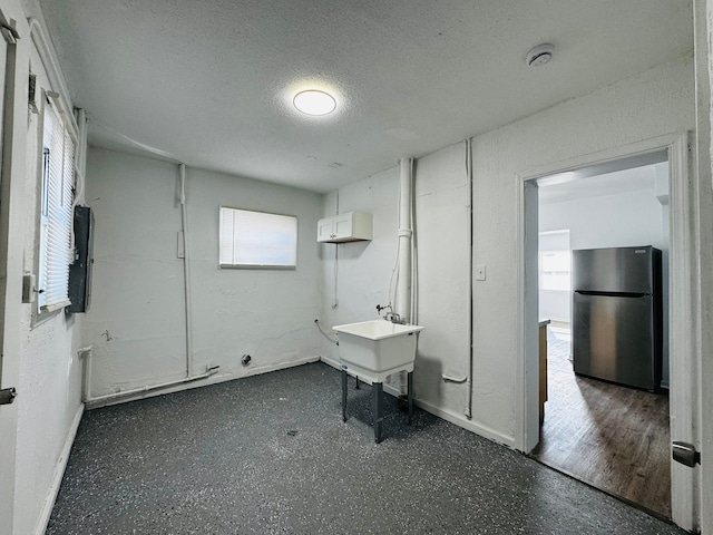 washroom with a textured ceiling