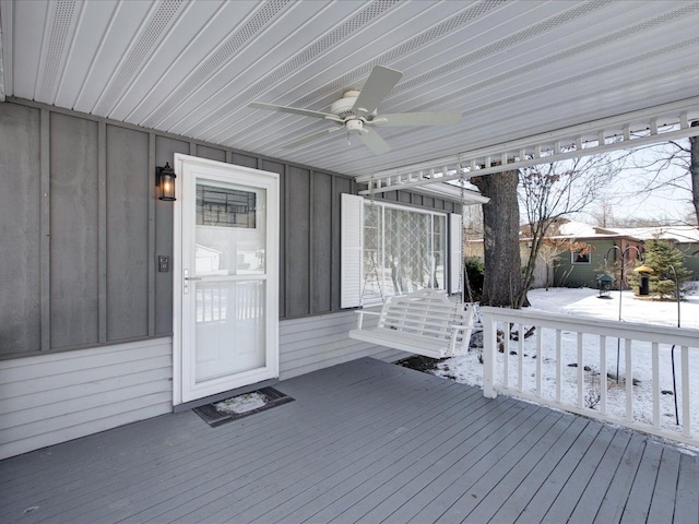 snow covered deck featuring ceiling fan