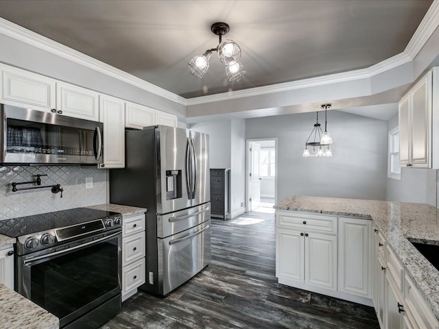 kitchen featuring white cabinetry, an inviting chandelier, decorative light fixtures, ornamental molding, and appliances with stainless steel finishes