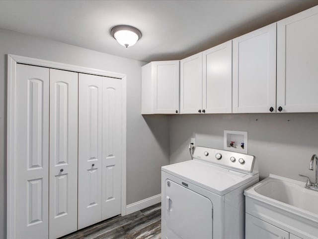 laundry area with washer / clothes dryer, dark wood-type flooring, cabinets, and sink