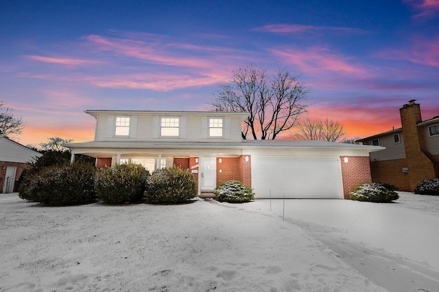 front of property with a garage