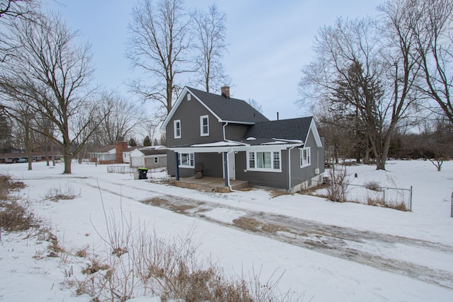 view of snow covered house