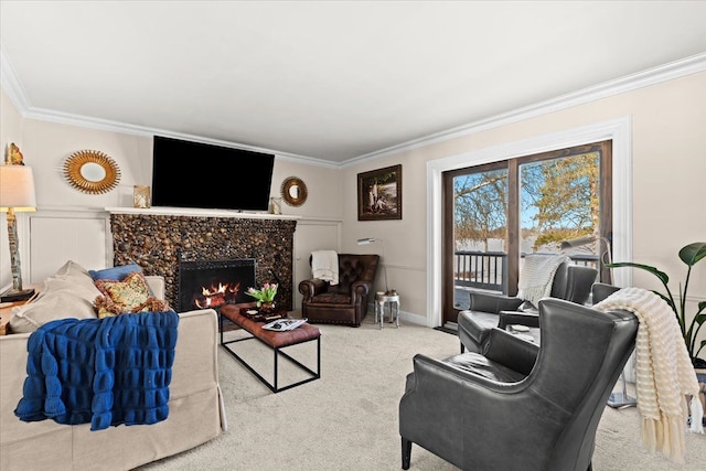 carpeted living room with ornamental molding and a high end fireplace