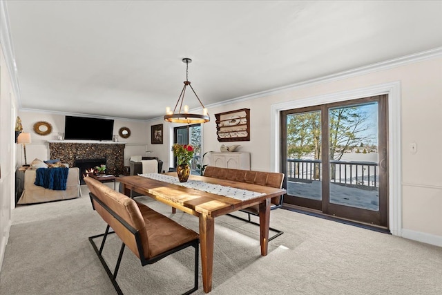 carpeted dining space featuring ornamental molding