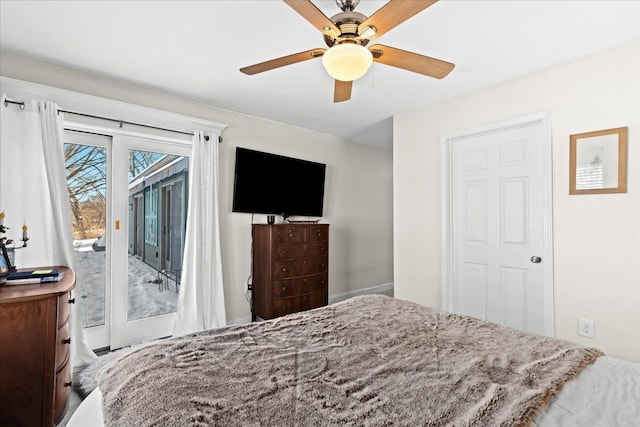 bedroom with access to outside and ceiling fan