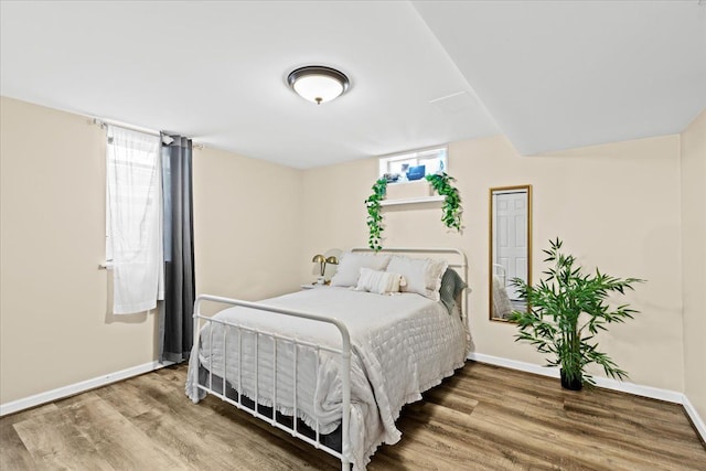 bedroom featuring wood-type flooring